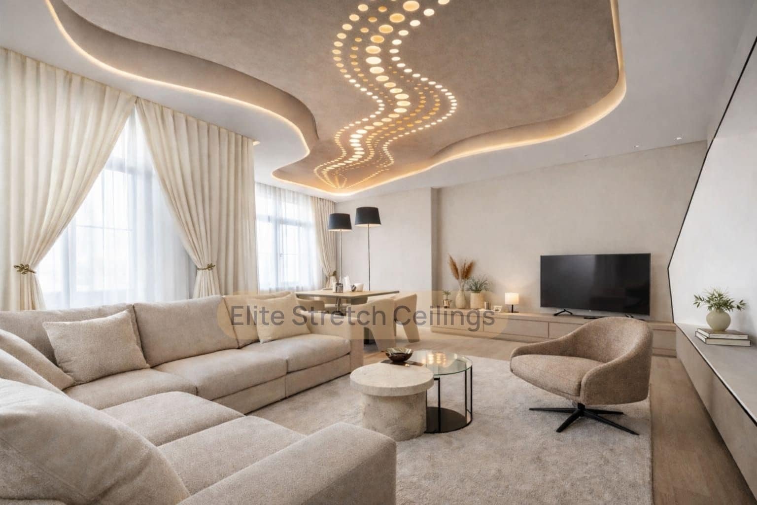 Perforated stretch ceiling with curved warm lighting in a modern residential living room.